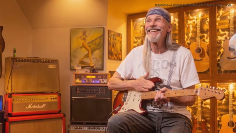 Ending G: Steve looks up smiling and pats the guitar.